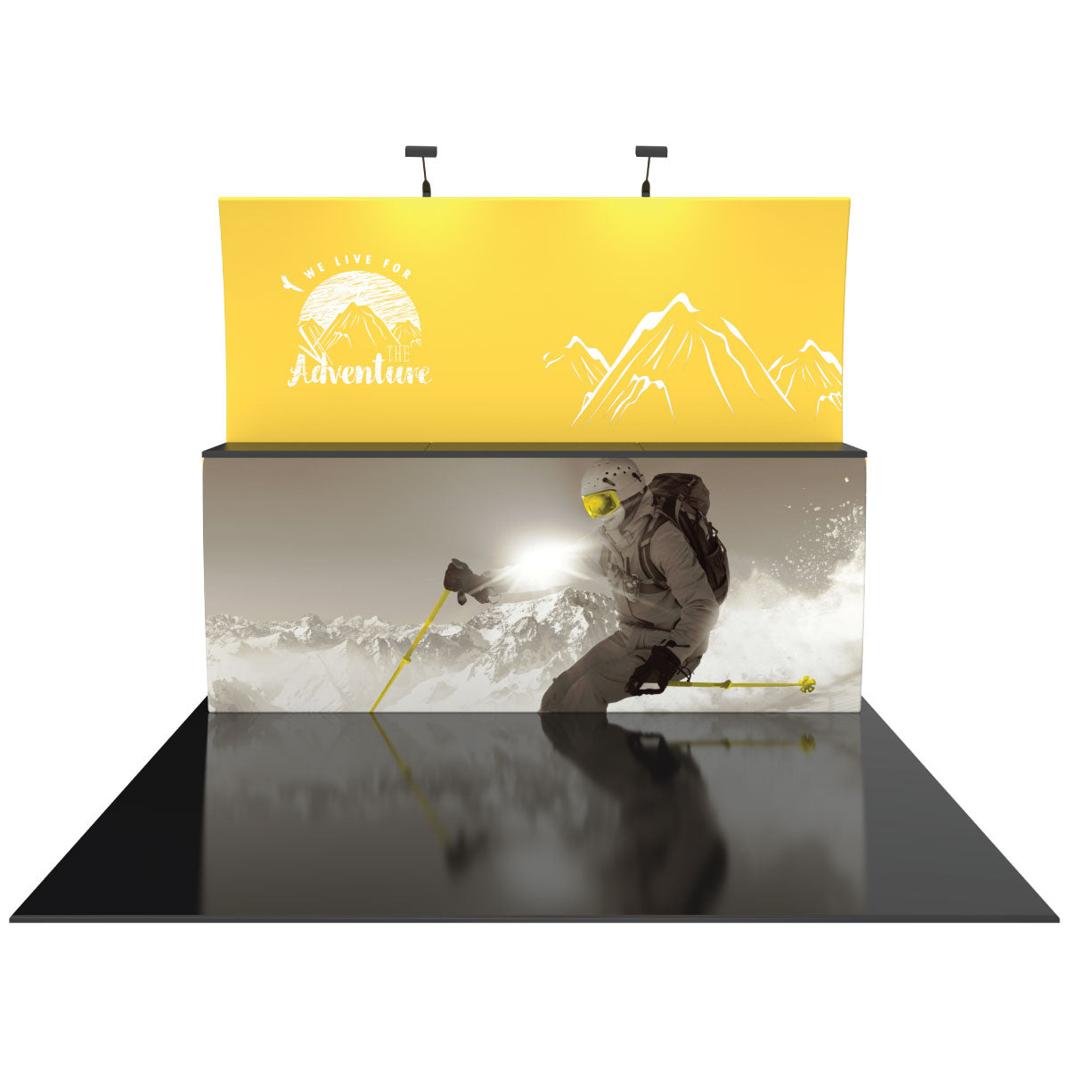 Trade show display with graphic panels featuring skier in action and mountain adventure theme