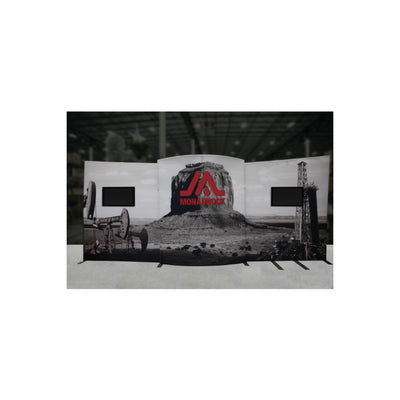 Trade show display backdrop featuring industrial landscape graphics with dual monitor mounts for exhibitions