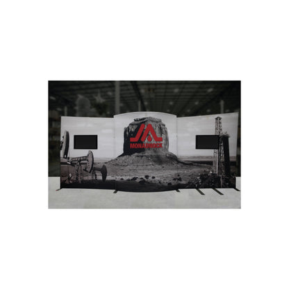 Trade show display backdrop featuring industrial landscape graphics with dual monitor mounts for exhibitions