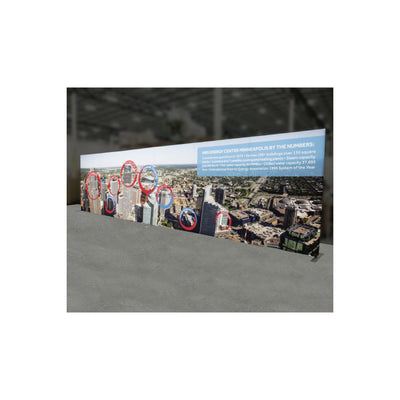Large freestanding trade show display with cityscape graphic and informational text for exhibitions and events