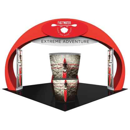 Trade show island booth with curved arch, branded signage, and kayak-themed graphics for extreme adventure events