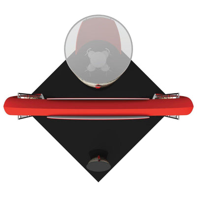 Top view of a trade show island booth setup with round table, chairs, and curved counters on black flooring