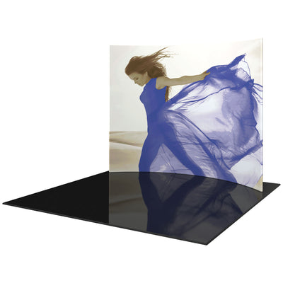 Curved fabric display kiosk featuring a large banner of a woman with flowing fabric, ideal for trade shows and exhibitions