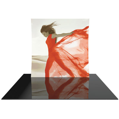 Curved fabric trade show display with modern fashion image on reflective event floor