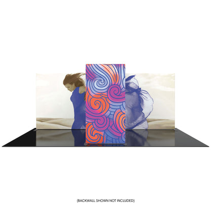 trade show display with a large central curved panel and back wall graphics featuring a person in flowing fabric