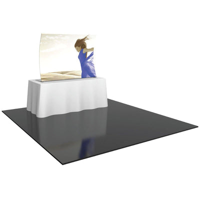 Tabletop display with graphic panel featuring a woman in flowing dress for trade shows and events