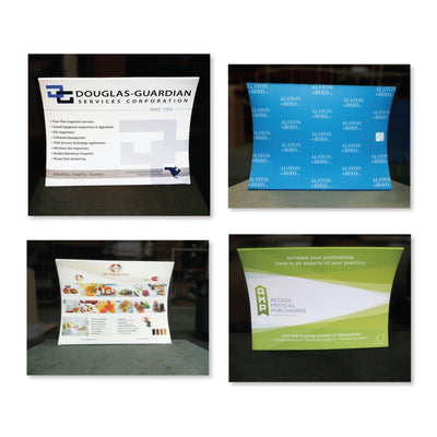 Four curved tabletop trade show displays featuring corporate branding and product information for exhibitions and special events