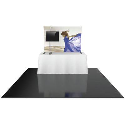 Trade show tabletop display with fabric backdrop featuring a woman graphic and mounted monitor stand