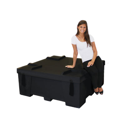 Woman sitting on large sturdy case suitable for trade shows and special events equipment transport