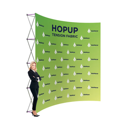 Trade show tension fabric backdrop display with branding, showcased by businesswoman at exhibition