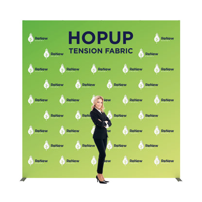 Tension fabric hopup display backdrop for trade shows with branded logos and a professional woman