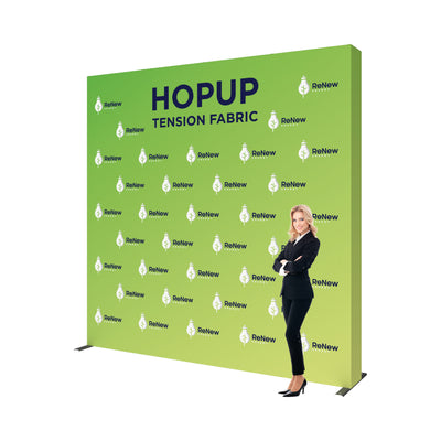 Large tension fabric backdrop display branded for trade shows and exhibitions with standing presenter