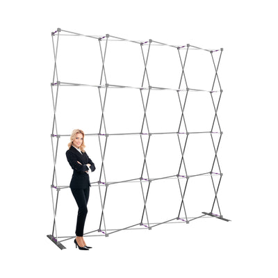 Freestanding collapsible frame for trade show displays with businesswoman standing beside it