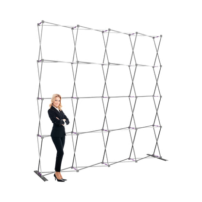 Freestanding collapsible frame for trade show displays with businesswoman standing beside it