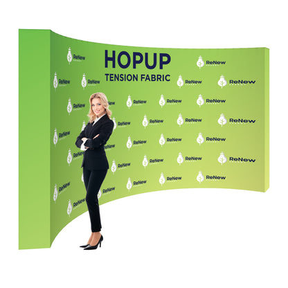 Trade show display with curved tension fabric backdrop featuring ReNew Energy branding and woman in business attire