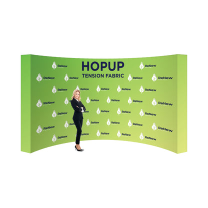 Curved tension fabric trade show backdrop with company branding and businesswoman in front for exhibitions