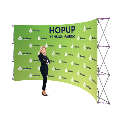 Curved tension fabric display with graphic branding for trade shows and exhibitions, woman presenting