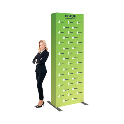 Trade show tension fabric display stand with company branding and businesswoman in professional attire