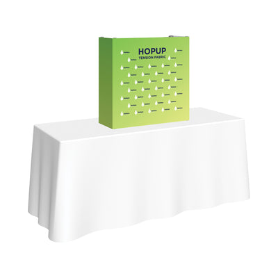 Tension fabric hopup display on table for trade shows and exhibitions branding