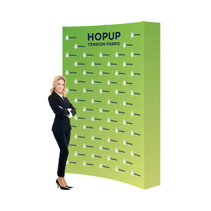 Trade show display with tension fabric backdrop featuring ReNew Energy branding and a businesswoman in front