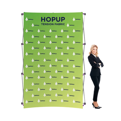 Tension fabric trade show backdrop display with ReNew Energy branding and businesswoman for exhibitions