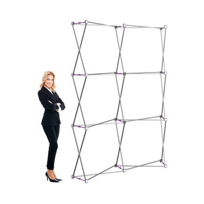 Woman standing next to a collapsible frame structure for trade shows, exhibitions, and events