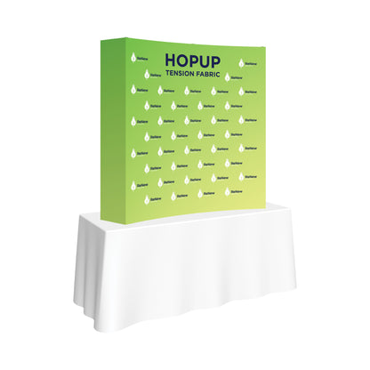 Tension fabric pop-up display on table for trade shows and special events branding