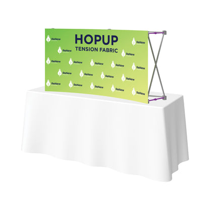 Tension fabric pop-up display on a table, ideal for trade shows and exhibitions