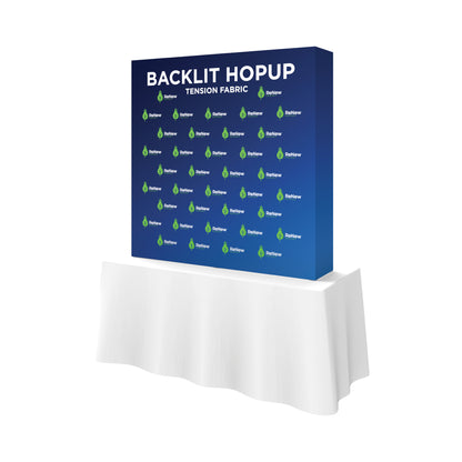 Backlit hopup tension fabric display on table for trade shows and exhibitions