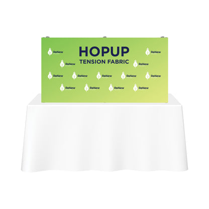 Trade show fabric backdrop with ReNew Energy logo and HopUp tension fabric branding on display for exhibitions