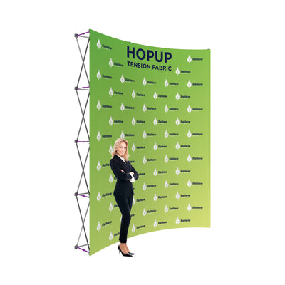 Trade show fabric backdrop display with woman standing in front, ideal for exhibitions and events