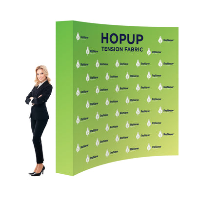 Curved tension fabric trade show display with ReNew Energy branding and businesswoman standing beside it