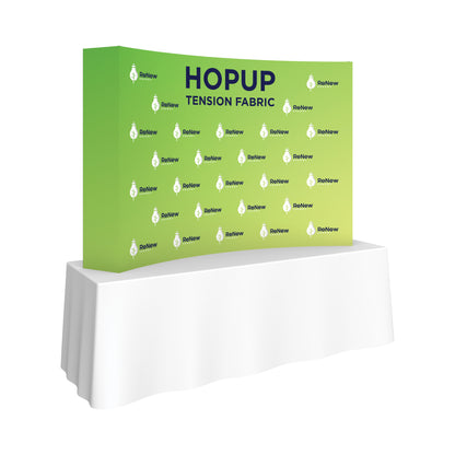 Curved tension fabric display with Renew Energy branding on a table for trade shows and exhibitions