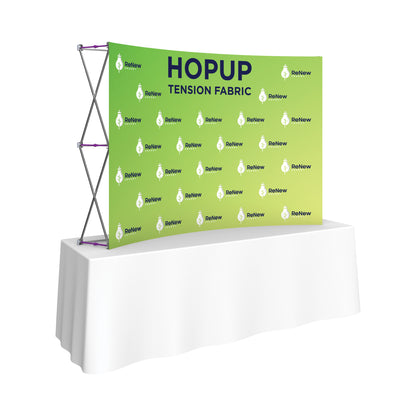 Pop-up tension fabric display on table for trade shows, exhibitions, and special events branding