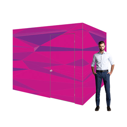 Modular trade show booth display with geometric panel design and business professional