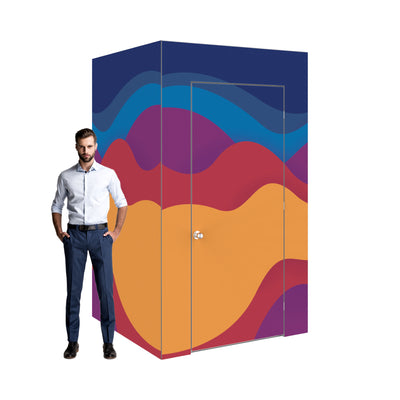 Modular trade show booth with decorative wave pattern and closed door beside standing man
