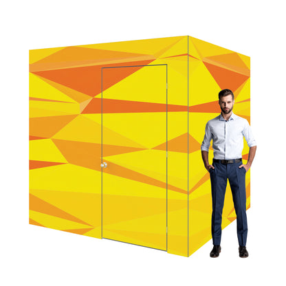 Modular trade show room with geometric design and man standing beside for scale at exhibition