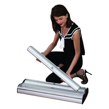Woman assembling a retractable banner stand for trade shows and exhibitions
