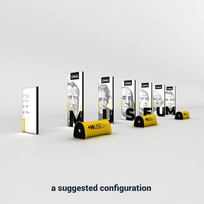 Trade show display setup featuring tall vertical panels with portraits and bold letters, plus branded seats for exhibitions
