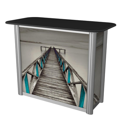 portable trade show counter with printed graphic panel featuring a wooden pier extending into water for exhibitions and events