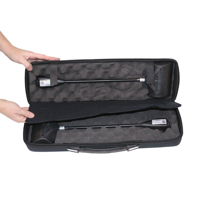 Protective carrying case with foam inserts holding two portable trade show spotlights for exhibitions and events