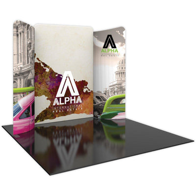 Curved modular trade show display with Alpha International Real Estate branding and architectural graphics
