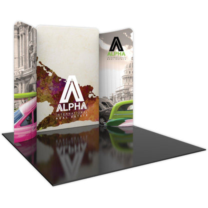 Curved modular trade show display with Alpha International Real Estate branding and architectural graphics
