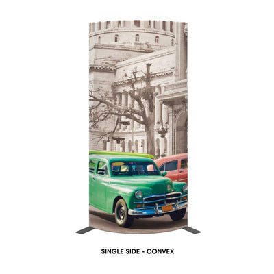 Freestanding curved trade show display featuring vintage car and architectural backdrop for exhibitions