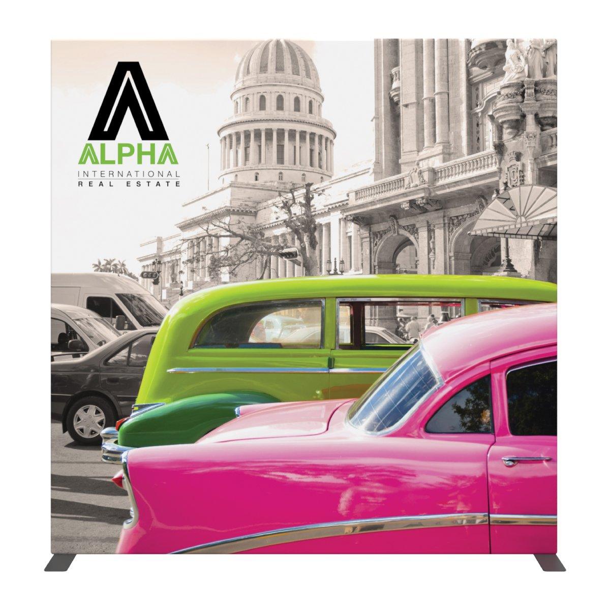 Trade show display featuring vintage cars and historic building backdrop for real estate marketing
