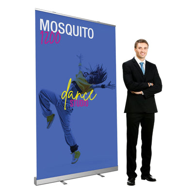 Retractable banner stand with dance studio design displayed at trade shows and events next to businessman