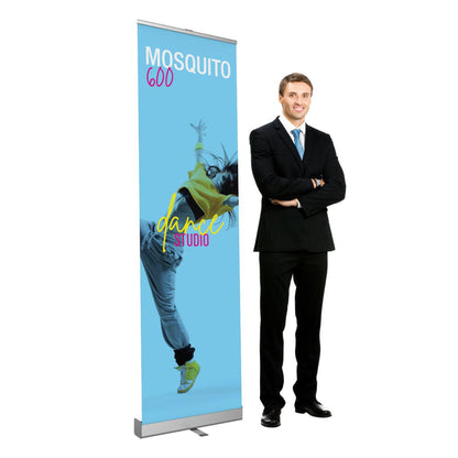 Retractable banner stand featuring dance studio promo next to man in business suit for trade show display