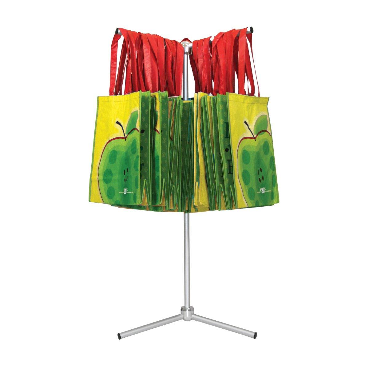 Rotating bag rack holding promotional tote bags designed for trade shows and exhibitions