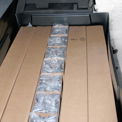 Trade show shipping case packed with organized cardboard boxes and protective packaging for exhibition equipment