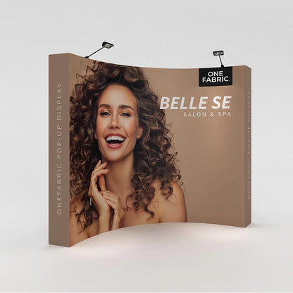 Curved fabric pop-up display featuring salon and spa branding for trade shows and exhibitions